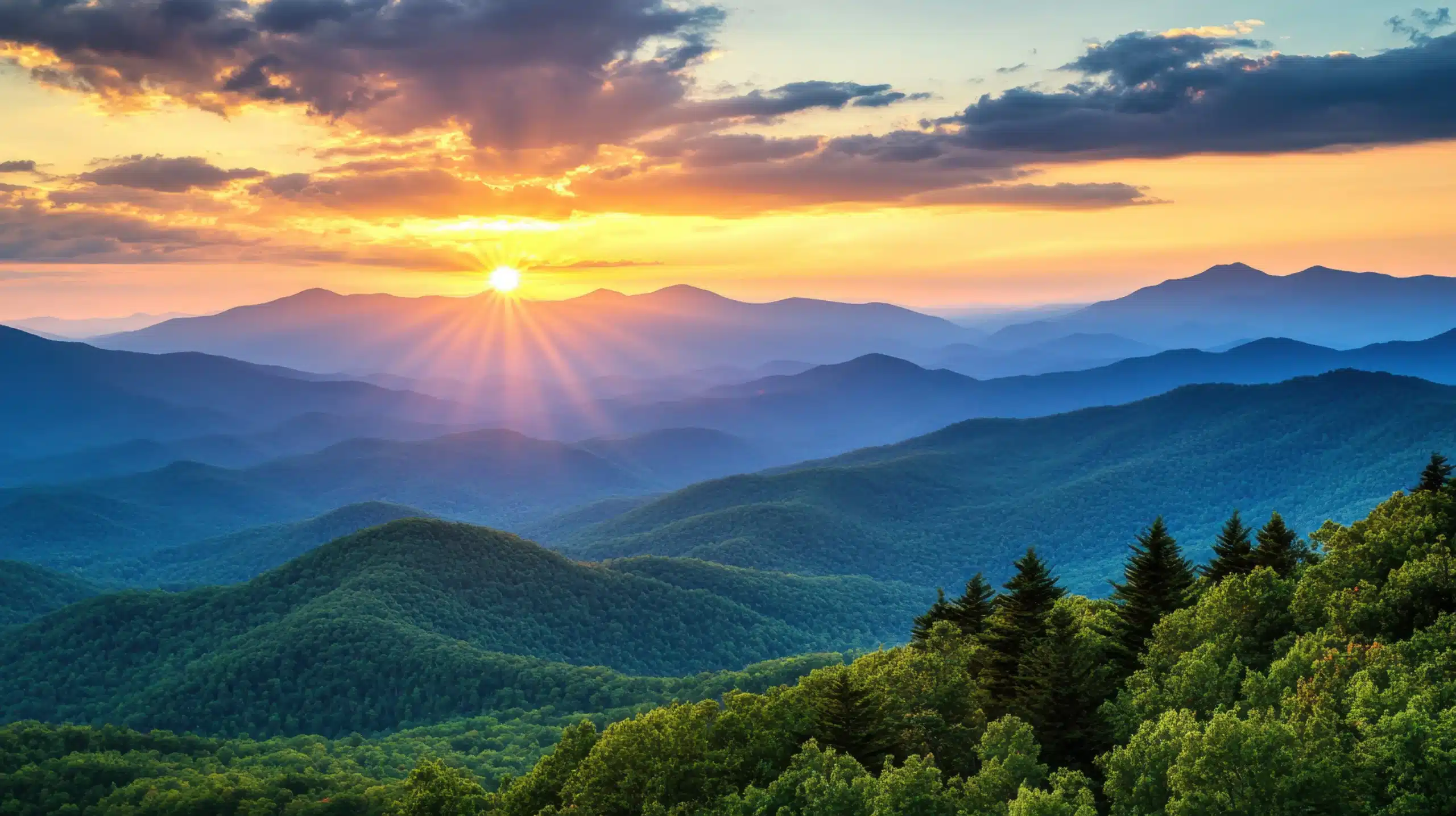 background photo of a sunset with mountains